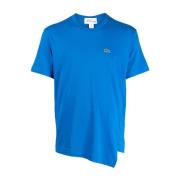 Comme des Garçons Lacoste Asymmetrisk T-shirt med Broderad Logotyp Blu...