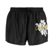 Moschino Svarta badshorts med blommönster för män Black, Herr