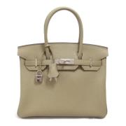 Hermès Vintage Pre-owned Laeder handvskor Beige, Dam