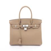 Hermès Vintage Pre-owned Laeder handvskor Beige, Dam