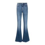 Alexander McQueen Distressed bomullsflared jeans med logotyp Blue, Dam