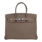 Hermès Vintage Pre-owned Laeder handvskor Beige, Dam