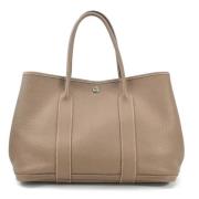 Hermès Vintage Pre-owned Laeder handvskor Beige, Dam